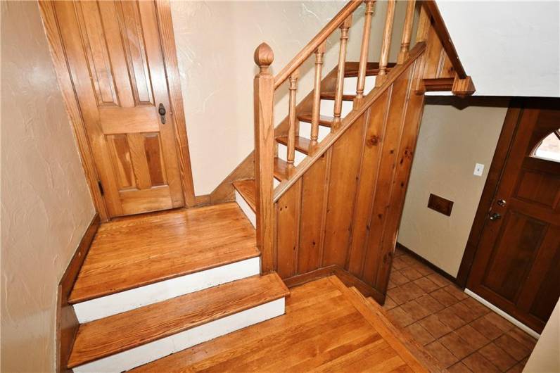 Main staircase with coat closet