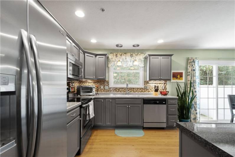 Stainless steel appliances throughout kitchen.