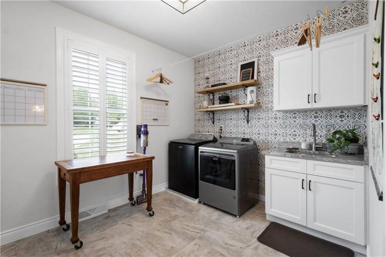 Convenient Laundry Room located off of the Kitchen. There are 2 pantry's in this room, just out of sight