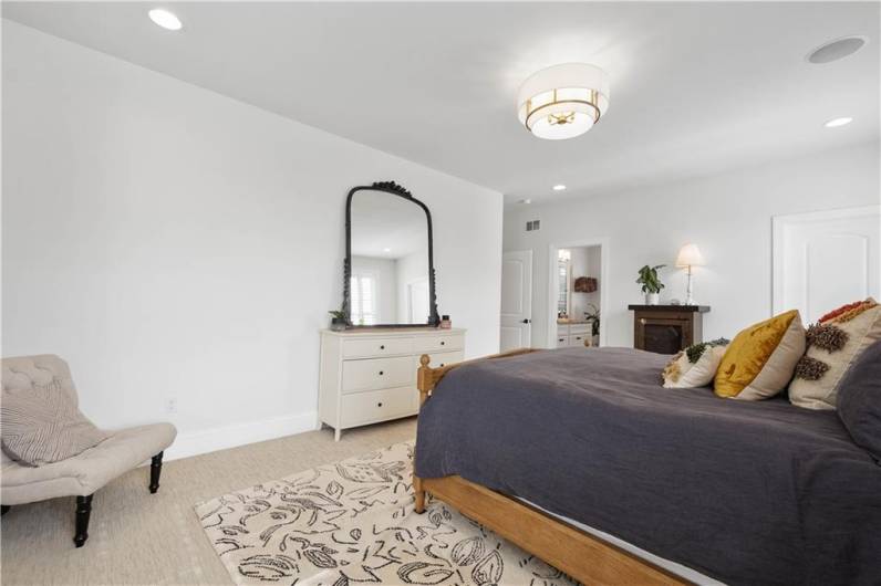 The main floor Primary Bedroom designed with high end Berber carpeting.