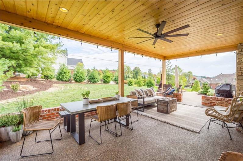 Expansive multi-zone covered Patio with built-in speakers.