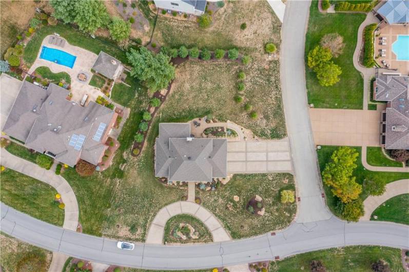 Aerial view of the property showing the landscape, front Govenor's driveway and Extra large side driveway.