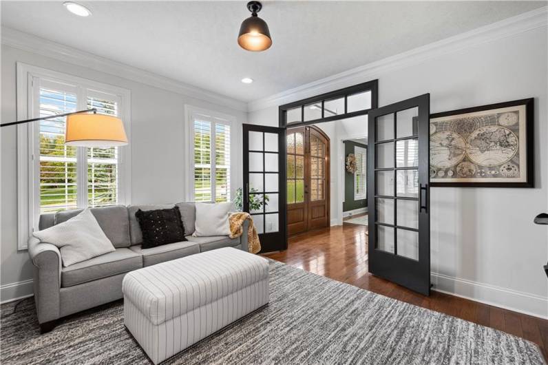 Private Den off of the entry with custom French Doors with Transom window.