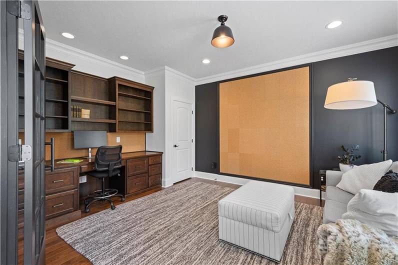 Built-in cabinets and cork board wall accent.