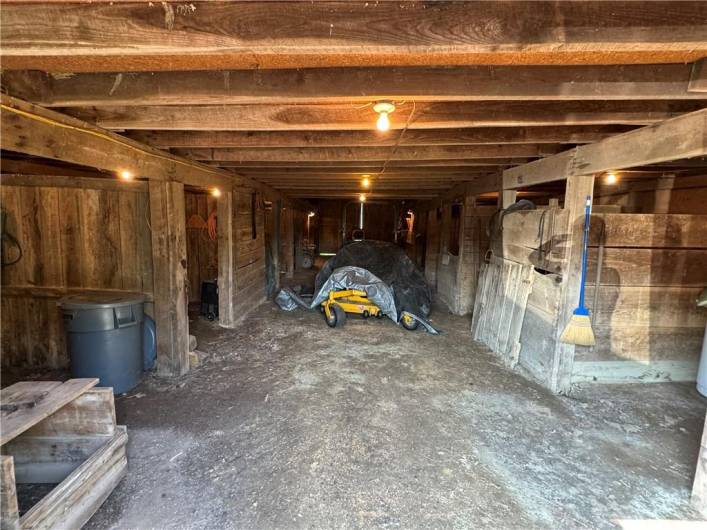 first barn building interior, several stalls