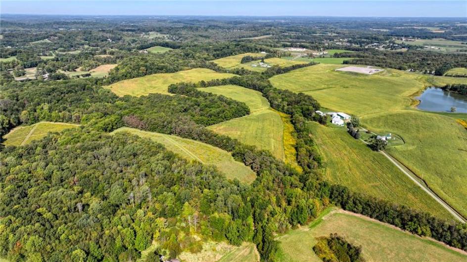 see field areas behind house and to the left.