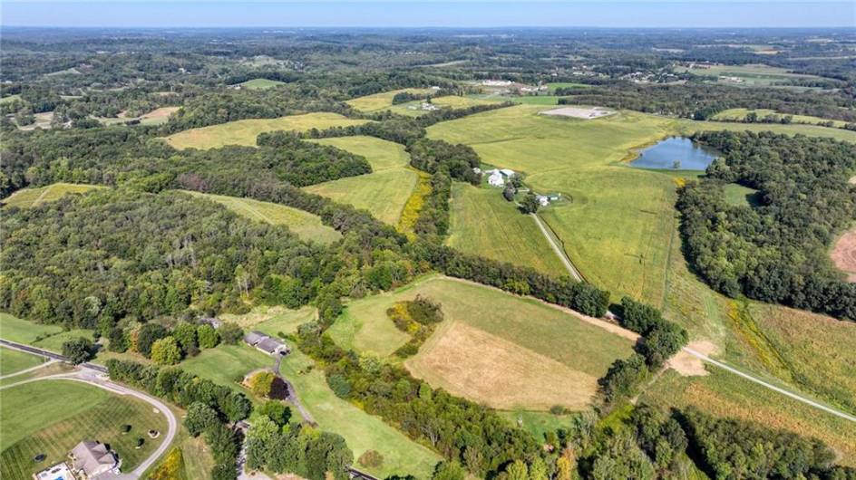 see field areas behind house and to the left. Survey in docs.