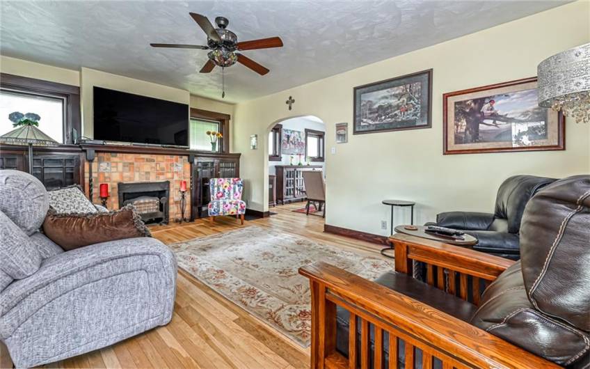 The Gorgeous Tile Fireplace & Mantle are the Focal Point of the 19x13 Living Room ~~ Look at the Floors!