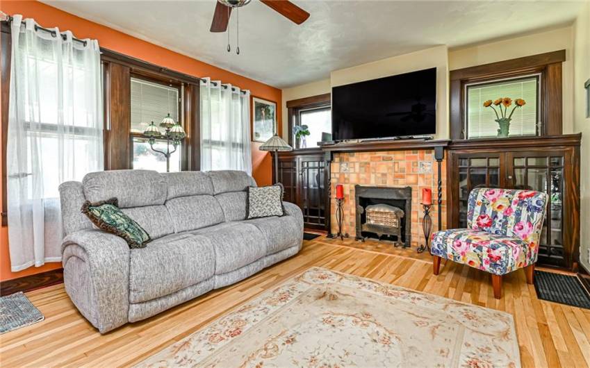 The Accent Wall Color compliments the Fireplace Tile Work & Beautiful Original Built In Bookcases add a Touch of Charm & Character