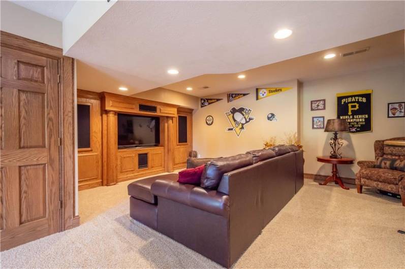 The lower level has an additional area for watching movies or your favorite sporting events.  TV and equipment stay.