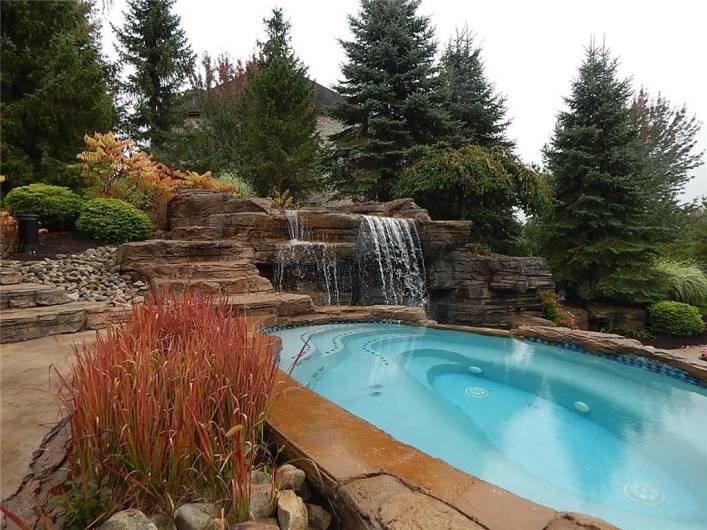 Hot tub overlooks the waterfall.