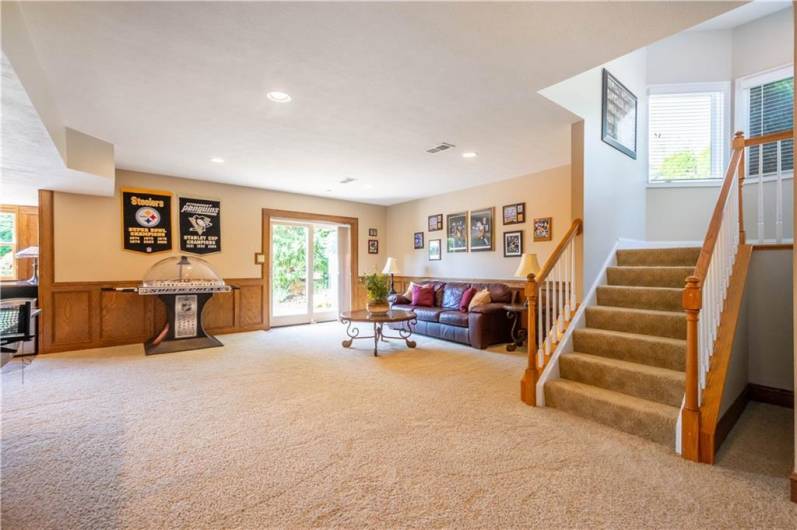 No detail was spared in the walk out lower level.  Wainscot paneling, walk-behind kitchenette with large pass thru windows to the pool area invite entertaining.