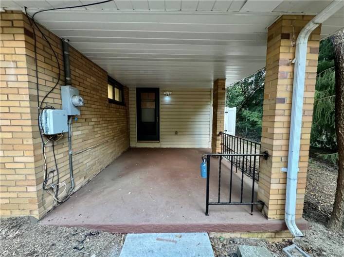 Cozy side porch with entry into kitchen