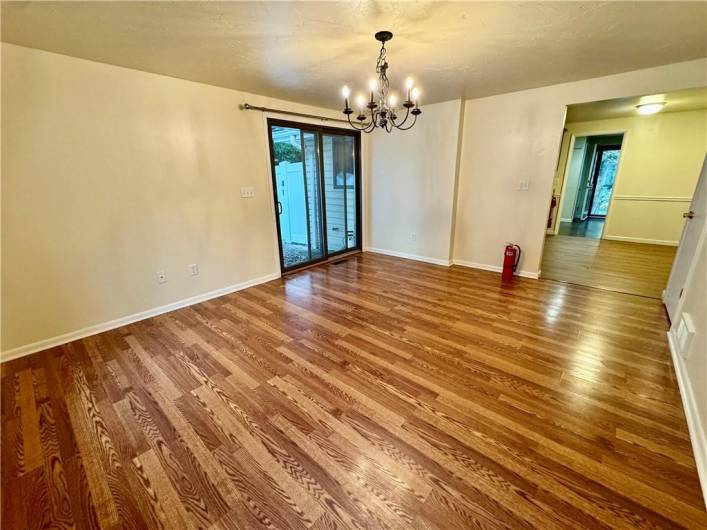 Sliding door to rear patio and fenced area of yard