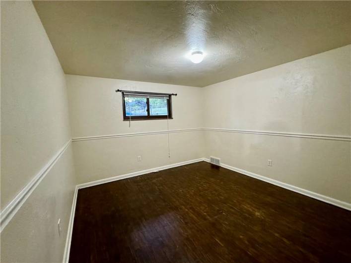 Middle bedroom with hardwood floor