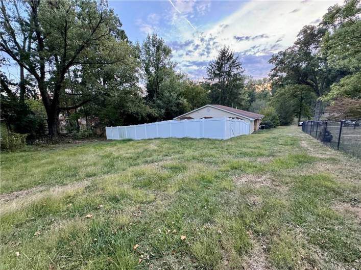 Rear yard, showing both fenced and unfenced areas