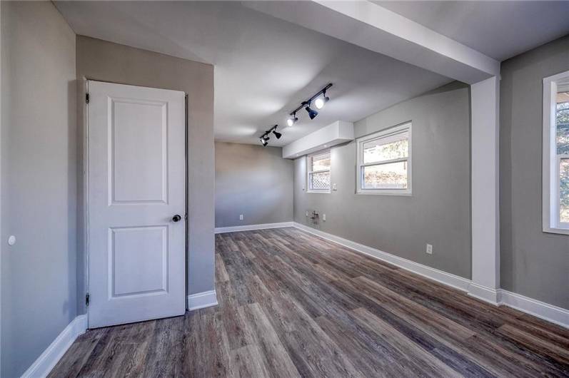 DINING ROOM AND DOOR TO LOWER LEVEL. APPROX. SIZE DINING ROOM 14'X8'.