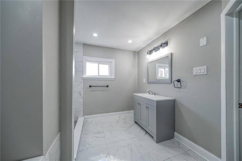 FL 2 FULL BATHROOM CERAMIC TILE FLOORS, ACCENTING SOAKER TUB AND STAND UP SHOWER. APPROX. SIZE 11'X9'.