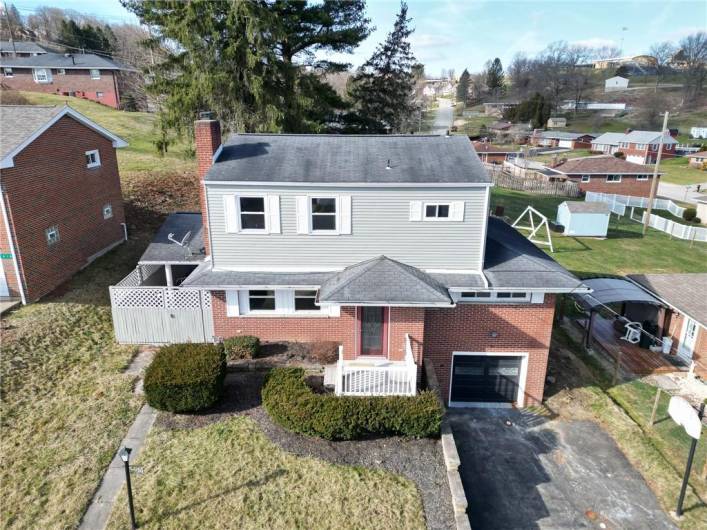 DRONE VIEW OF 4 BDRM HOME. 1 CAR INTEGRAL GARAGE WITH DOUBLE WIDE DRIVEWAY FOR EXTRA VEHICLES.