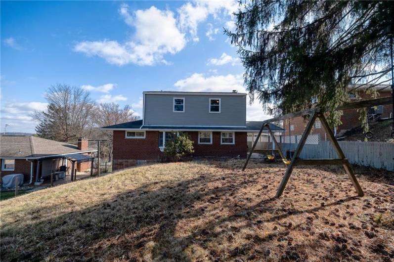 PLENTY OF ROOM FOR OUTDOOR ACTIVITIES IN THE BACK YARD.