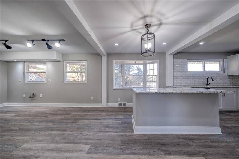 DINING ROOM/KITCHEN AREA. LUXURY VINYL FLOOR, GRANITE COUNTERTOPS.  APPROX. LENGTH 34'.