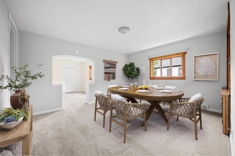 Large dining room measuring 15x13 and virtually staged