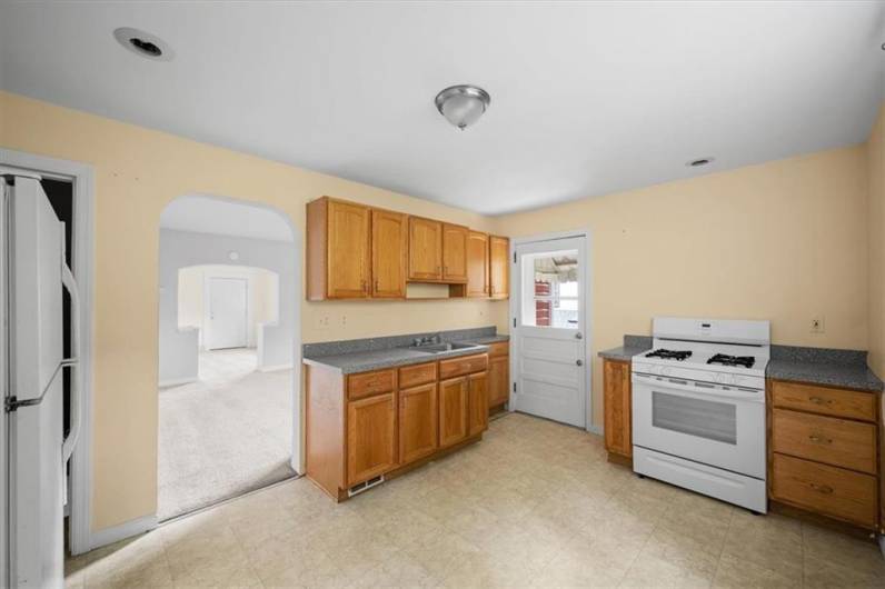 Kitchen and door leading to the side patio