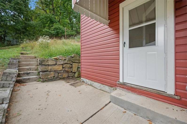 Side Patio off the kitchen and the perfect place for grilling and watching the sunset.