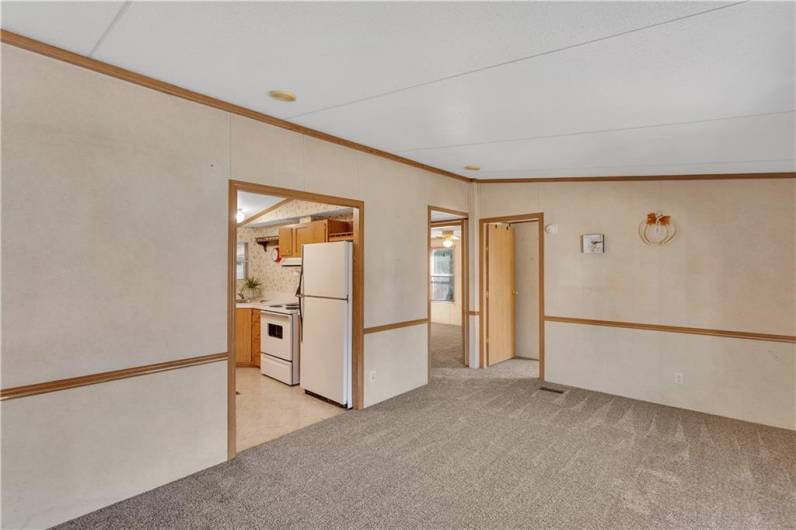 Partial views of the eat-in kitchen and access points to the 2nd and 3rd bedrooms.