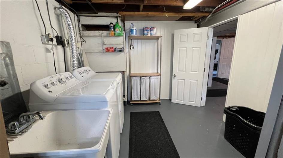 Large laundry room with a spare shower.