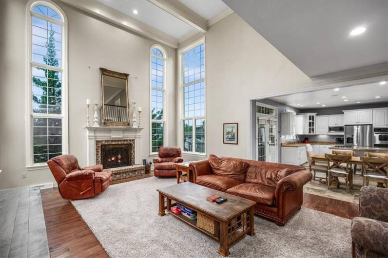 Engineered wood floors and open to the kitchen.