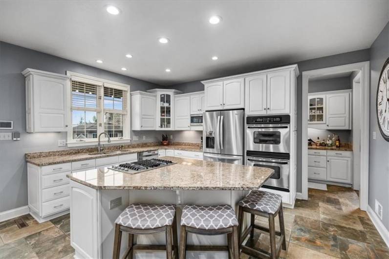 Counter height seating for 3 is the perfect spot for breakfast.