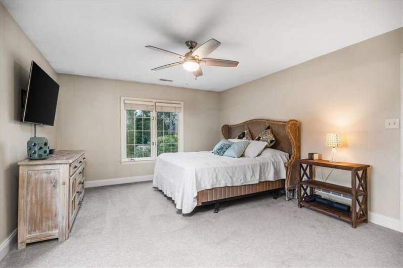 Generous bedroom on the second floor with ensuite bath and walk-in closet.