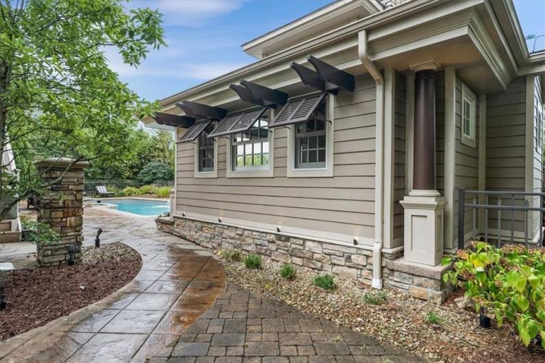 Entrance to pool area from the driveway - beautiful stamped concrete.