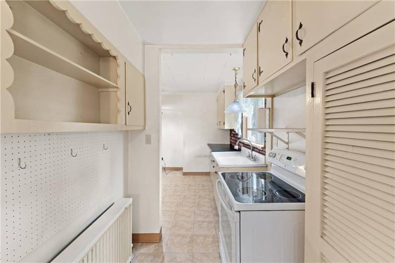 Ample pantry space between the kitchen and formal dining area.