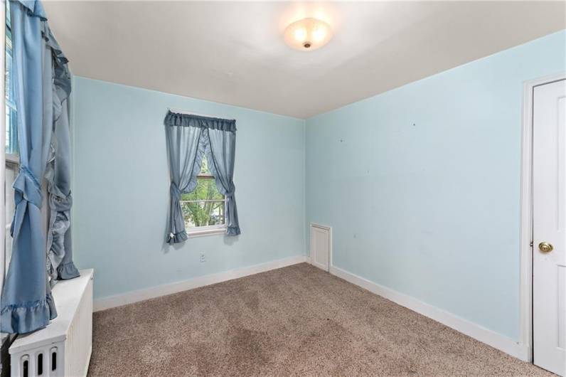 French doors lead to the primary bedroom.