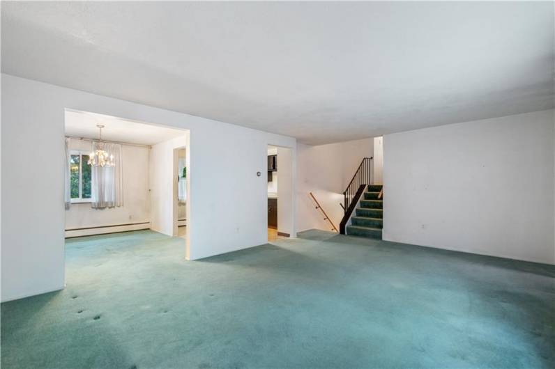 Head up half a flight of stairs to this main floor to enjoy this massive living room...