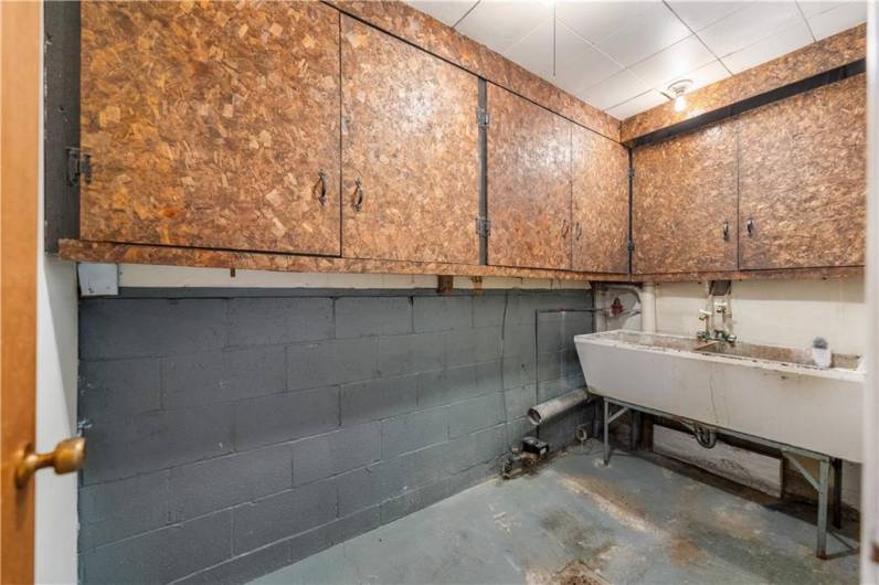 Off the entry is also this large laundry room w/ extra storage...