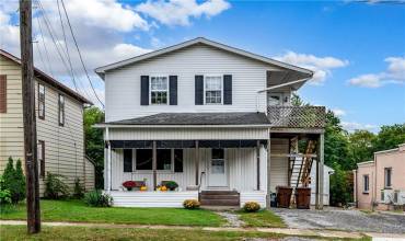 Covered front porch-perfect for relaxing.  Great street/location.