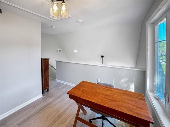 The loft overlooks the living room.