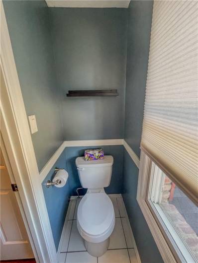 Half bath has a large window to leave in natural light