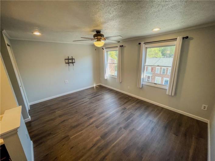 The main bedroom has new vinyl flooring.