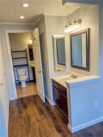 The primary bedroom has an extra vanity to make getting ready a breeze!