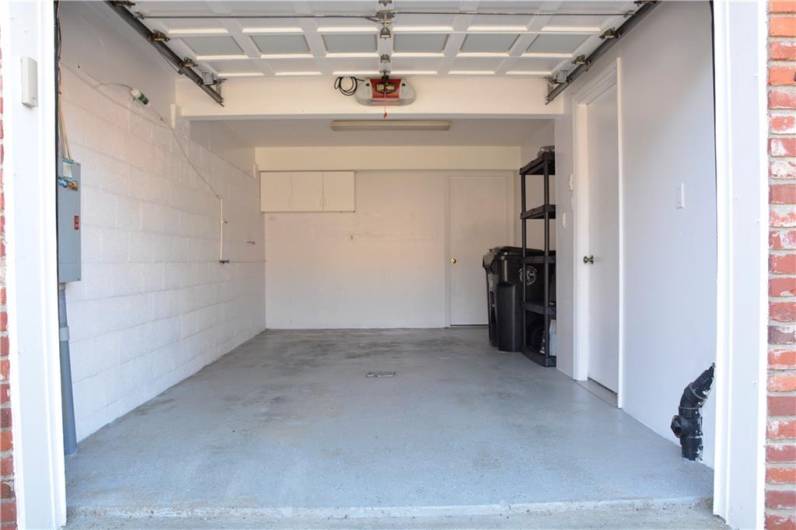 The garage has plenty of extra storage.