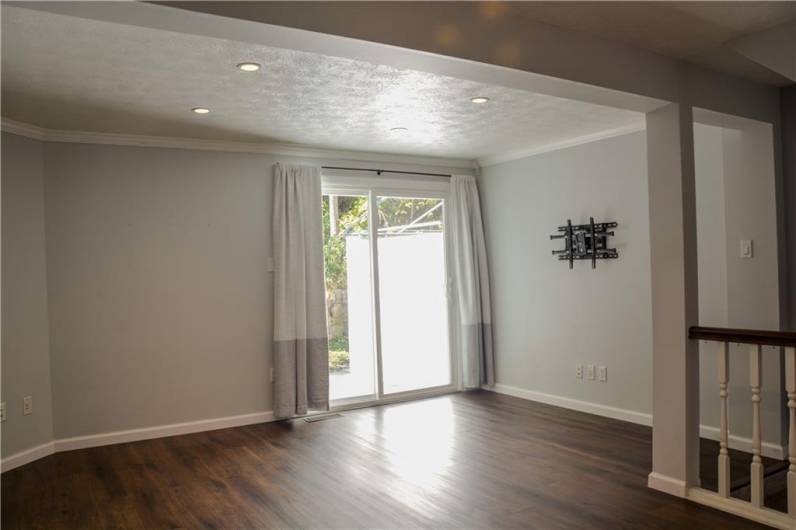 Bright living room with a new door to the deck.