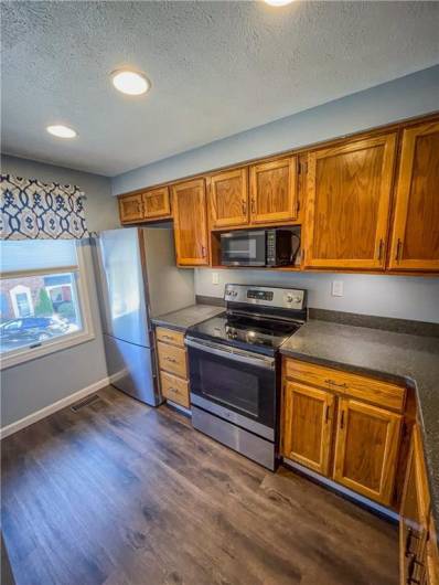 Kitchen is bright and spacious with natural light.