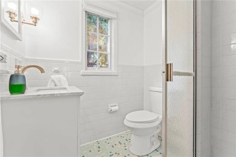 Second Full Bathroom Located on the Upper Level with Updated Mirror, Vanity, and Shower Floor. Both Original Ceramic Tile Floors have recently been Freshened Up by Stanley Steamer.