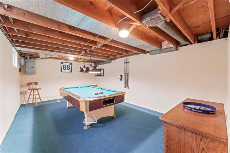 The Lower Level Includes a Roomy 21x13 Game Room Complete with Pool Table, Cue Sticks & Dart Board.