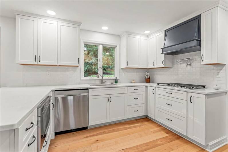 Sleek and Stylish Contemporary 12x11 Kitchen Remodel was Completed in 2024 & Boasts All Brand New Stainless Steel Appliances Including a GE Profile Gas Cooktop, Samsung Dishwasher, Delta Farmhouse Sink & Faucets & Gorgeous Soft Close Cabinetry.