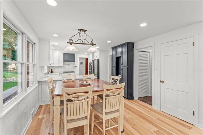 The 11x8 Open Concept Breakfast Area Overlooks the Spacious & Green Back Yard.